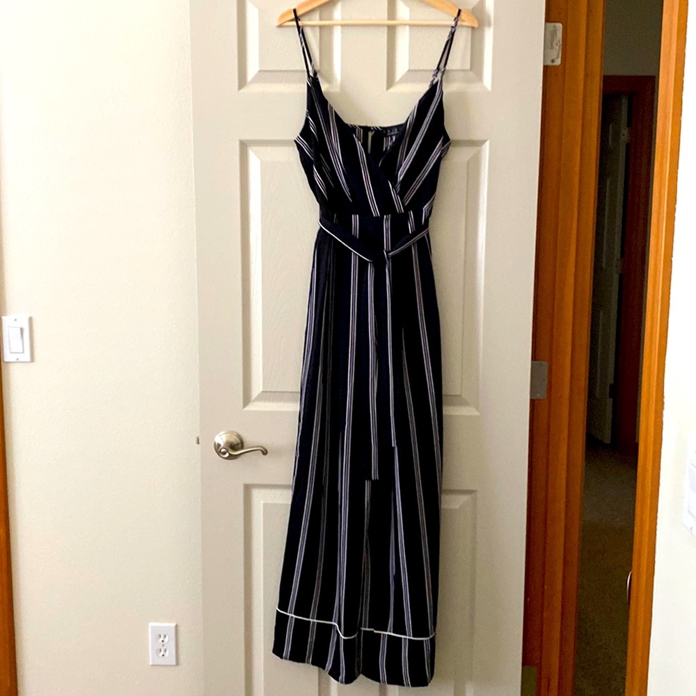 Super cute jumpsuit in black and white. Size M